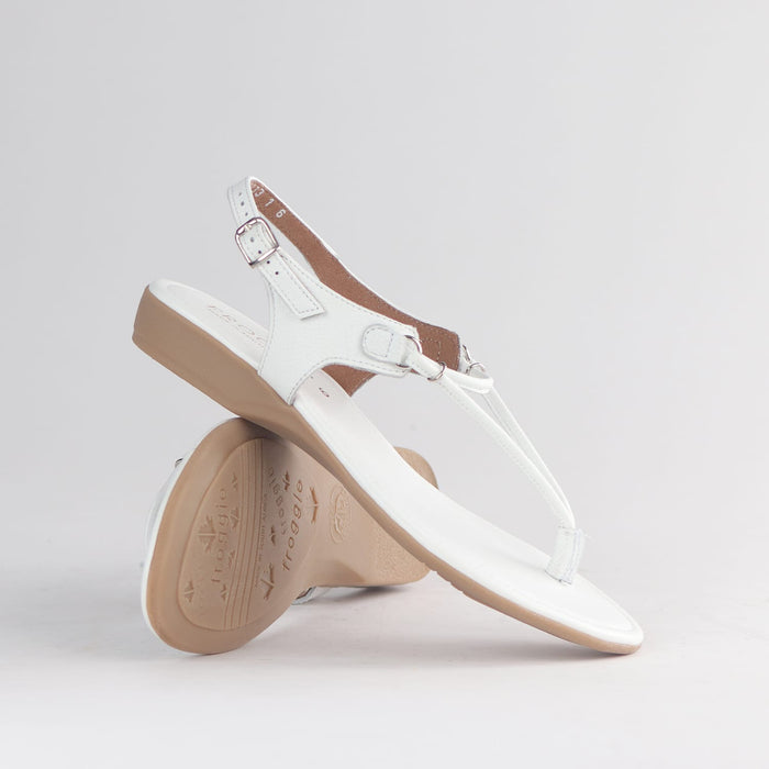 White leather women’s thong sandal by Froggie with delicate spaghetti straps, slip-on fit, and minimalist warm-weather style. 13075
